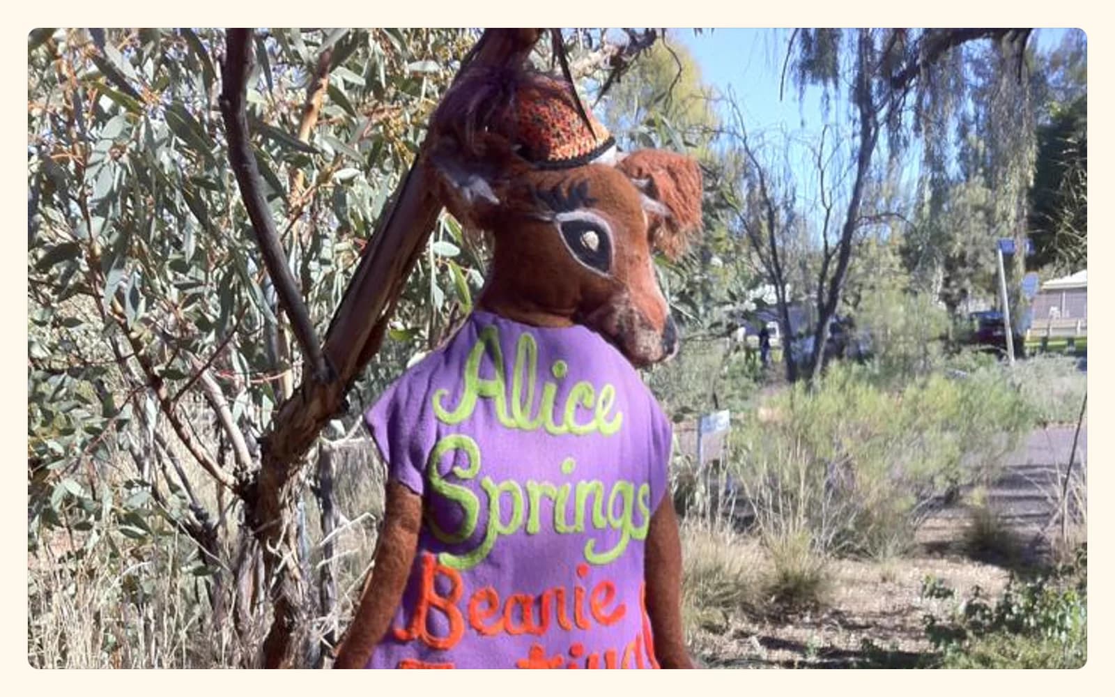A real kangaroo sculpture stands beside an Alice Springs Beanie Festival sign at the 2013 festival.